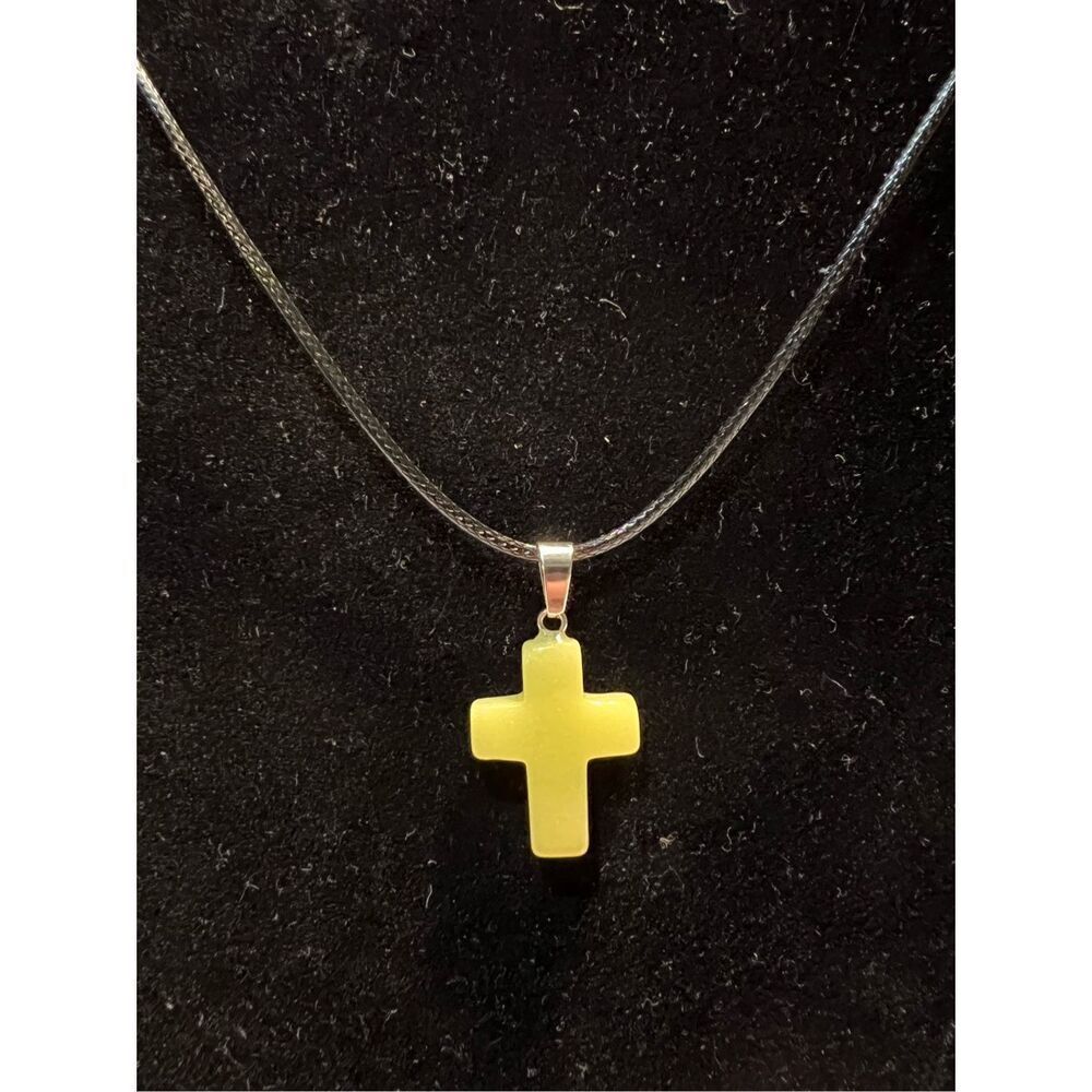 Yellow Stone Cross on a Black Necklace Cord